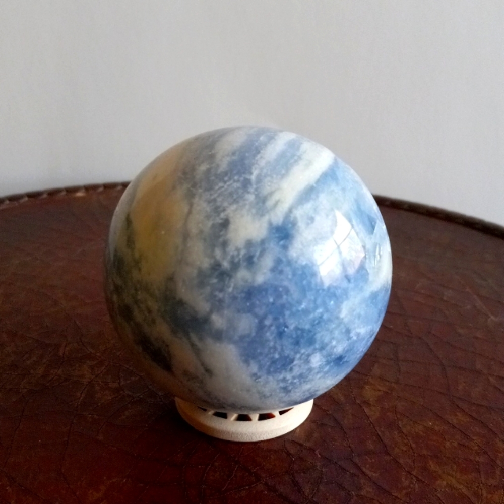 Blue calcite crystal sphere. 422g. Approx 2.6" width. 8.5" circumference. New.